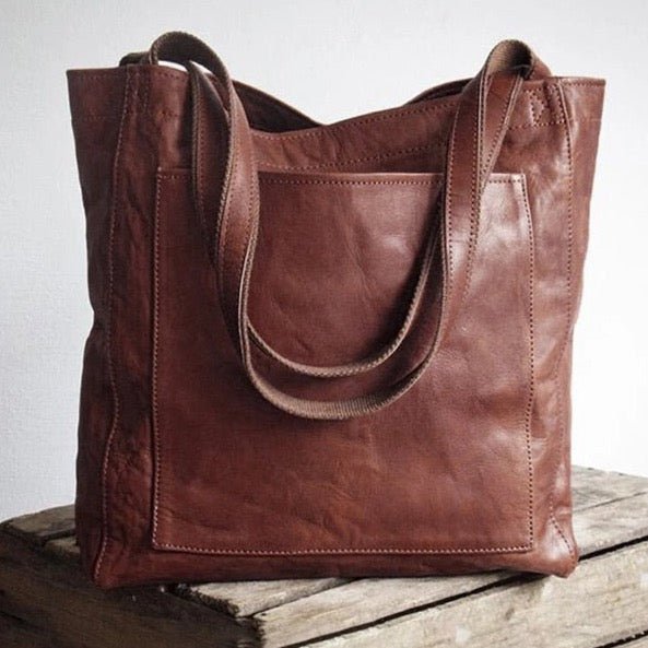 Leather bag with stain-resistant interior and zippered inner pocket
