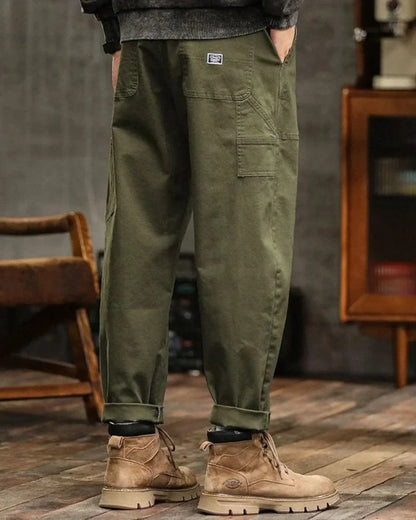 Cargo trousers with many pockets and rolled-up hems