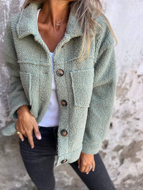 Fluffy coat with classic collar and patch pockets