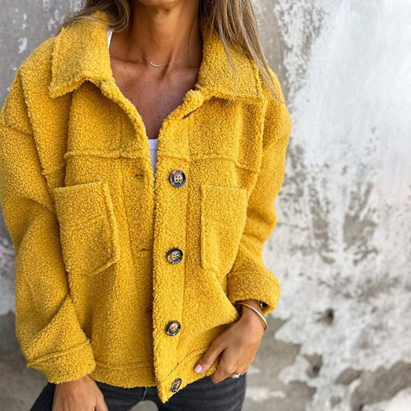 Fluffy coat with classic collar and patch pockets