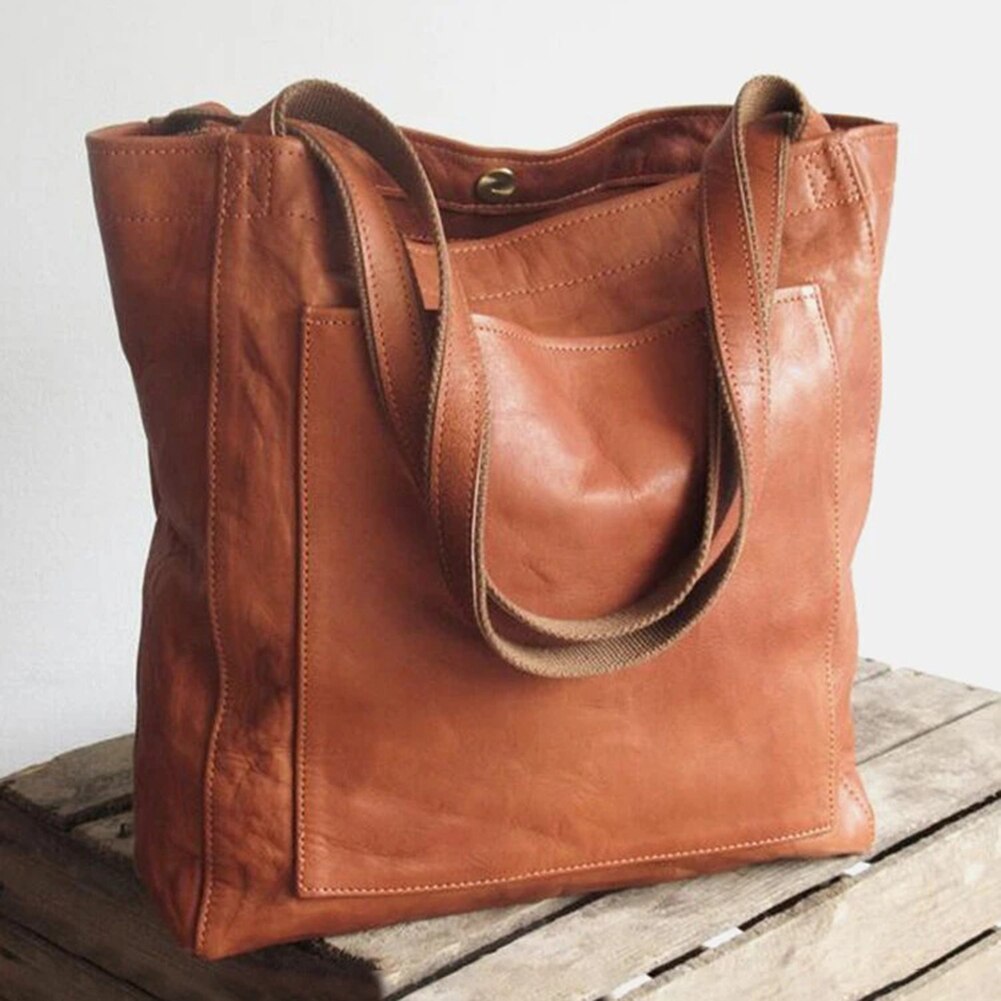 Leather bag with stain-resistant interior and zippered inner pocket