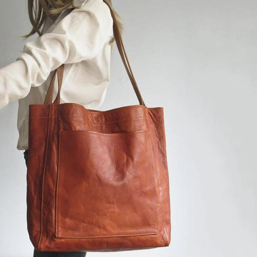 Leather bag with stain-resistant interior and zippered inner pocket