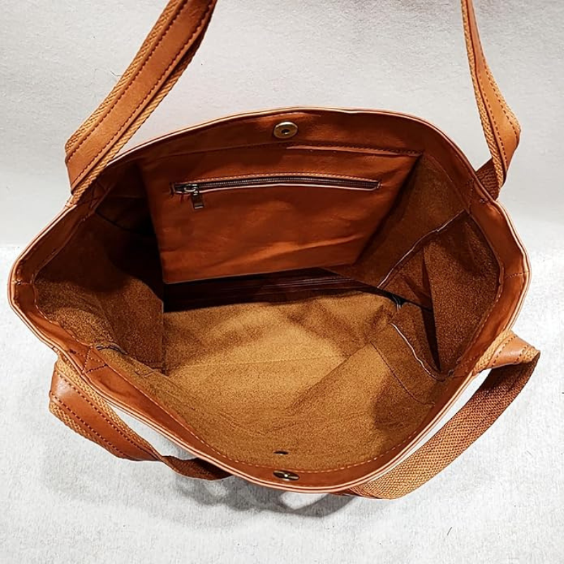 Leather bag with stain-resistant interior and zippered inner pocket
