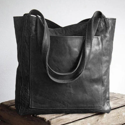 Leather bag with stain-resistant interior and zippered inner pocket