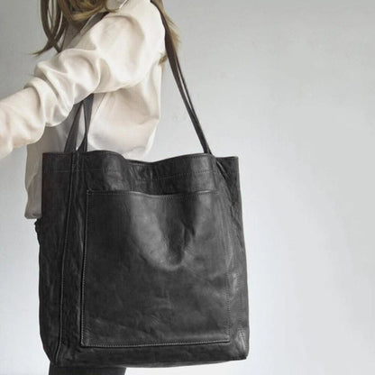 Leather bag with stain-resistant interior and zippered inner pocket