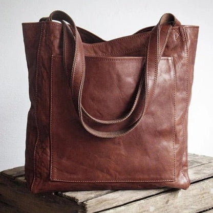 Leather bag with stain-resistant interior and zippered inner pocket