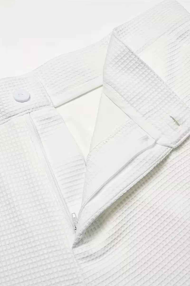 Lightweight fabric trousers with straight legs and side pockets