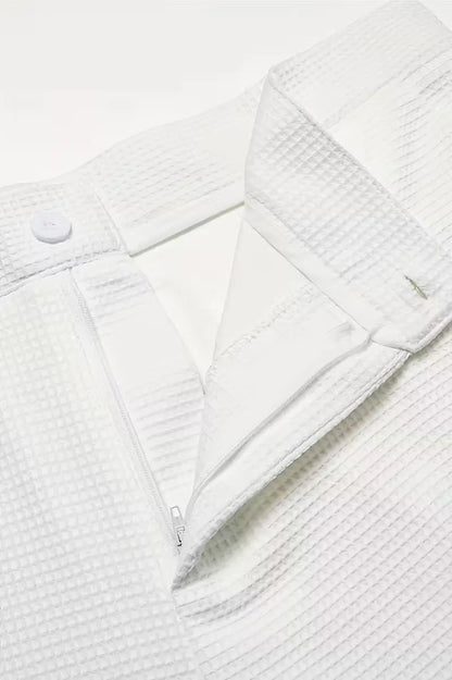 Lightweight fabric trousers with straight legs and side pockets