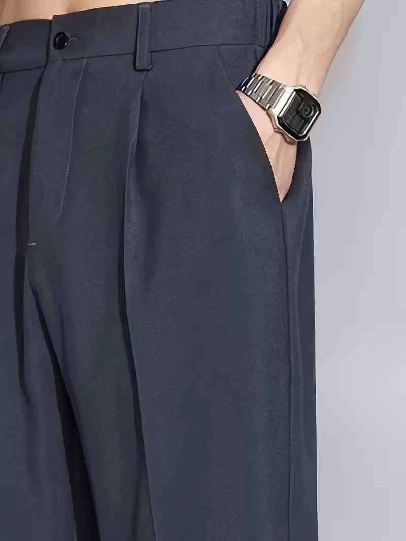 Straight trousers with pleated details and side pockets