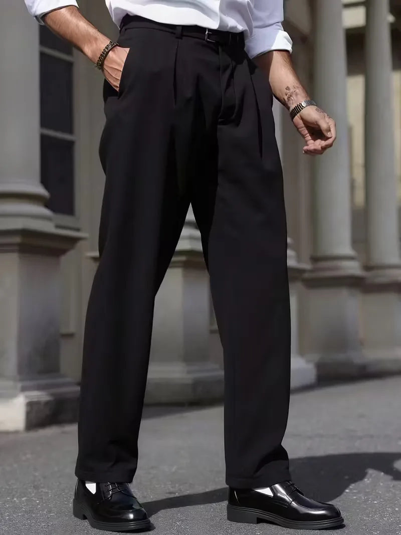 Straight trousers with pleated details and side pockets