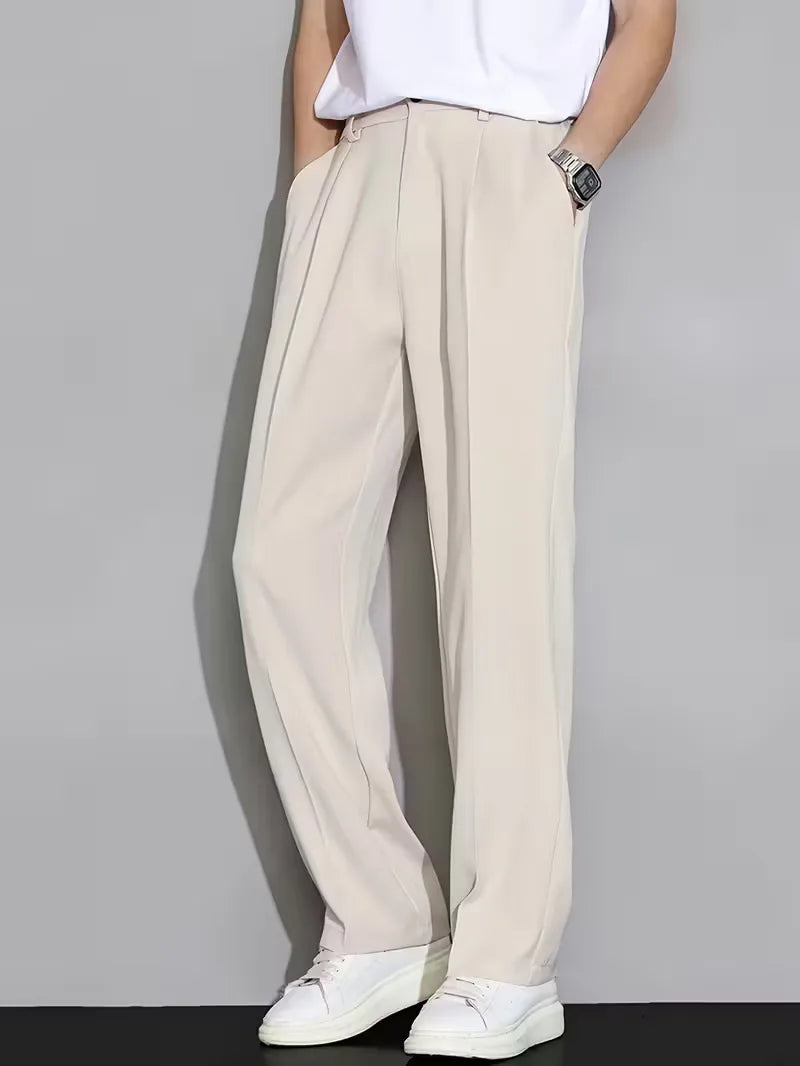 Straight trousers with pleated details and side pockets