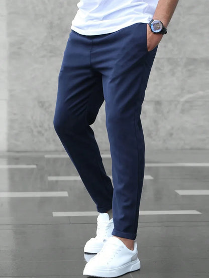 Slim fit trousers with elastic waistband and side pockets