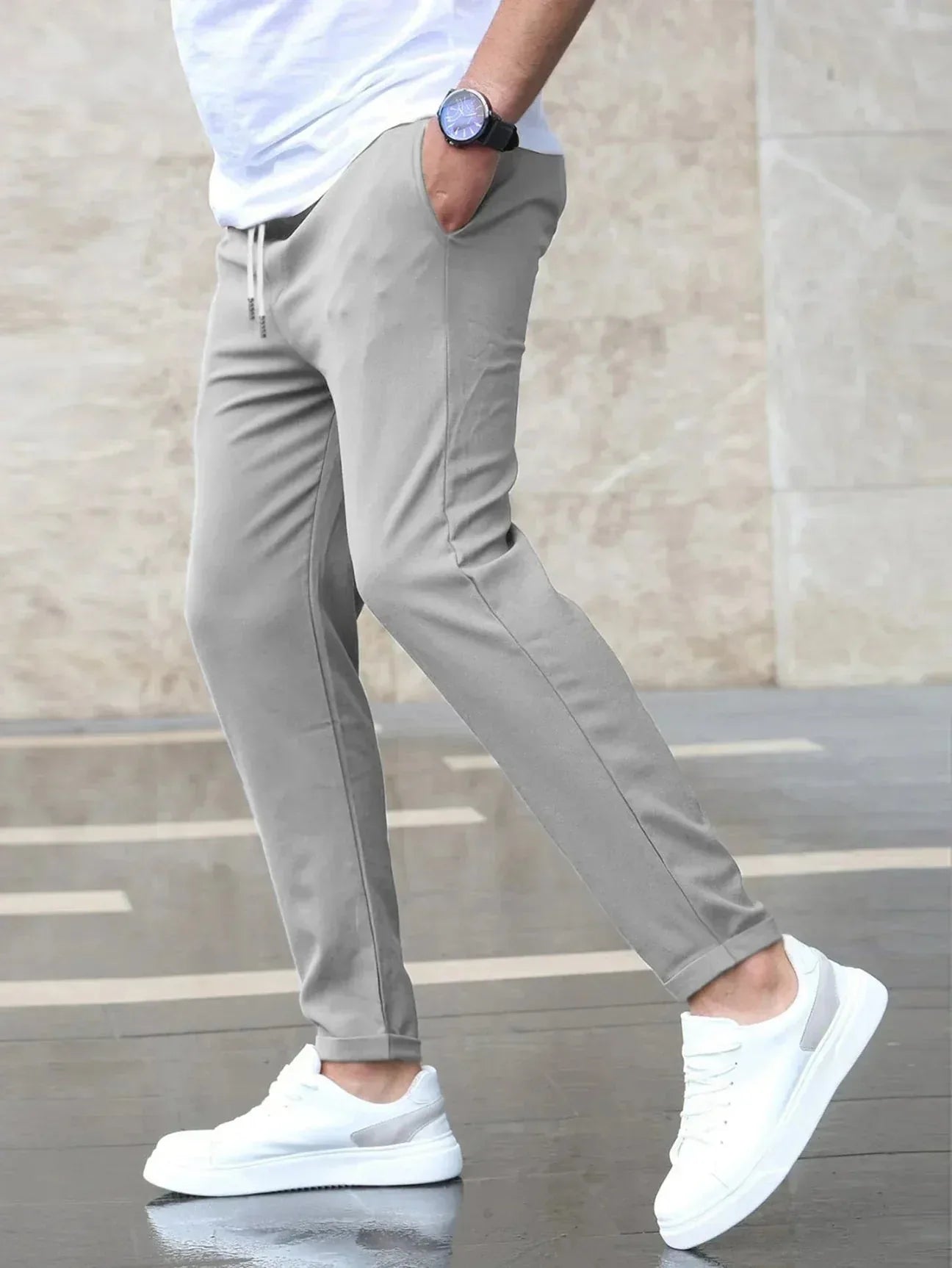 Slim fit trousers with elastic waistband and side pockets