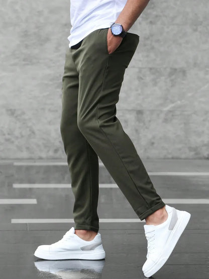 Slim fit trousers with elastic waistband and side pockets