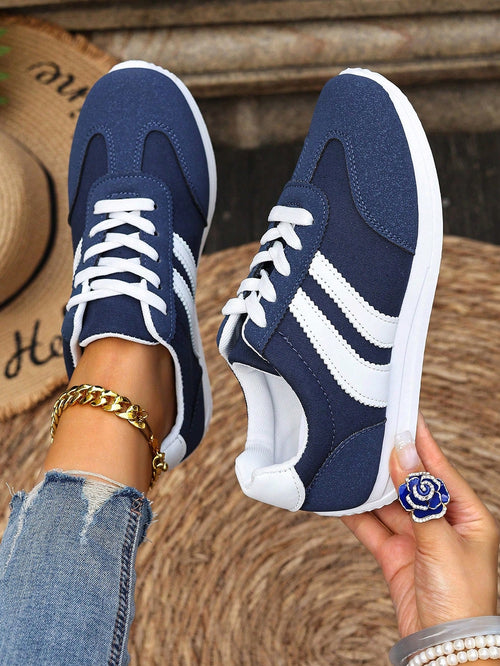 Sneakers with colour block design and lace-up closure