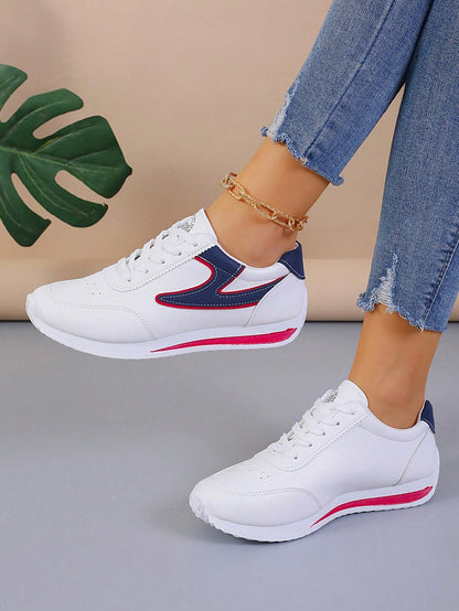 Sneakers with colour block design and lace-up closure