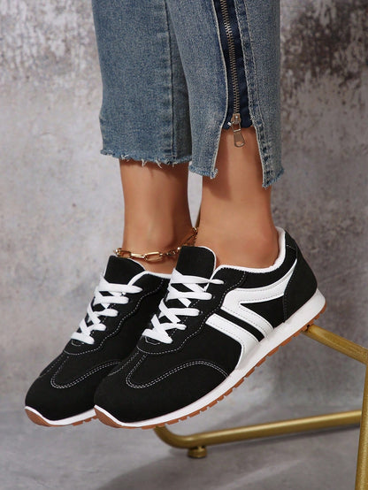 Sneakers with colour block design and lace-up closure