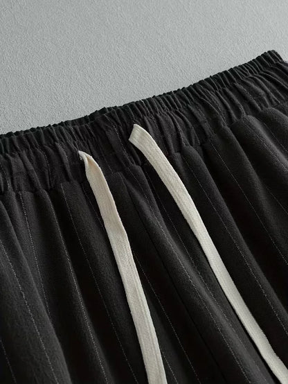 Wide fit trousers with vertical stripes