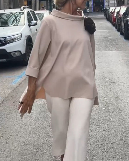 Elegant blouse with an irregular cut and long sleeves