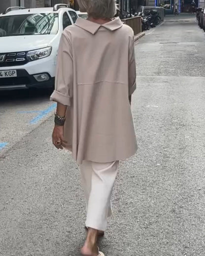 Elegant blouse with an irregular cut and long sleeves