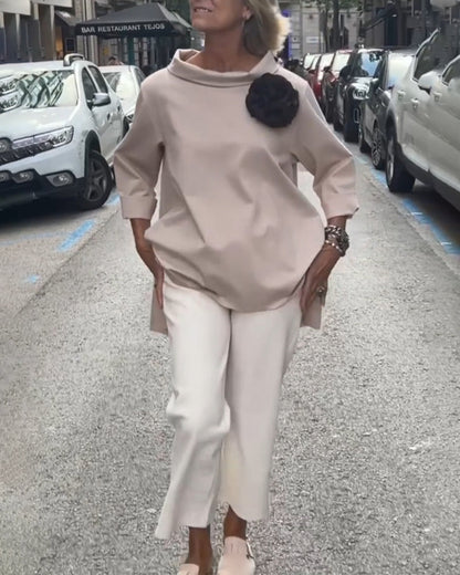 Elegant blouse with an irregular cut and long sleeves