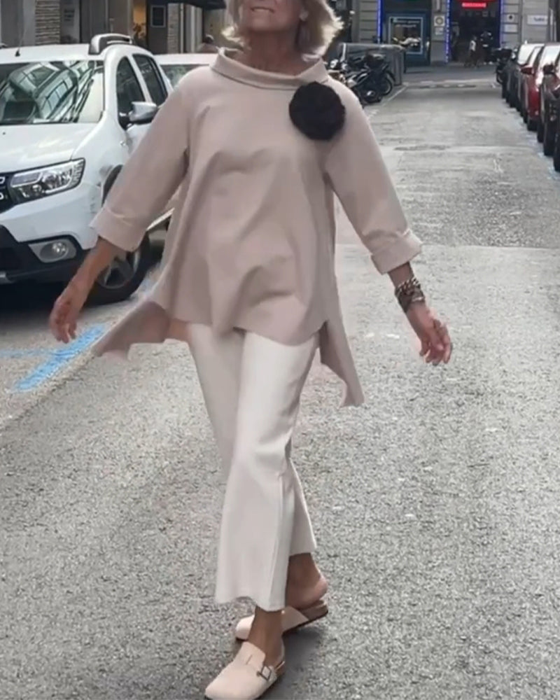 Elegant blouse with an irregular cut and long sleeves