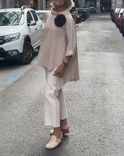 Elegant blouse with an irregular cut and long sleeves