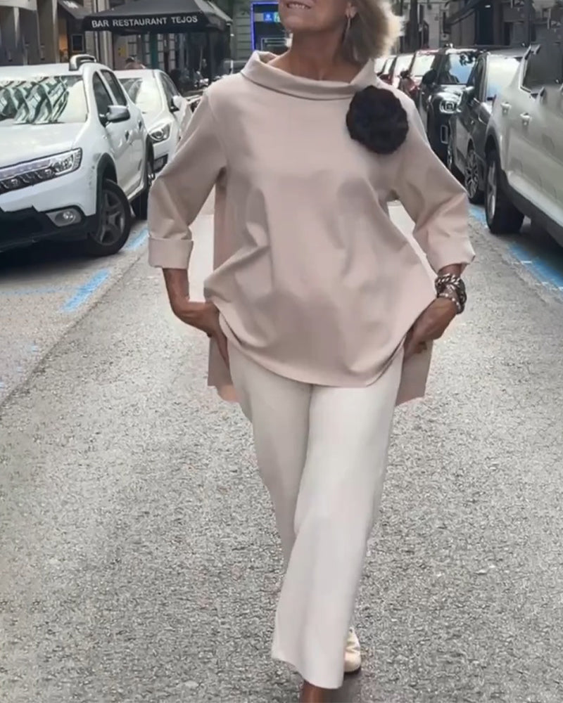 Elegant blouse with an irregular cut and long sleeves